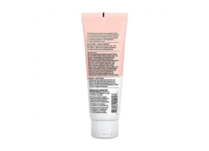 a tube of pink tinted cream on a white background