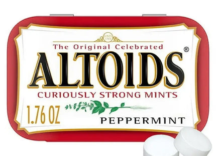 a close up of a tin of altoids with two white pills