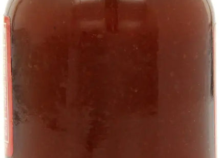 a jar of chocolate spread with a red lid