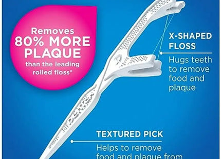 a white toothbrush with a pink background