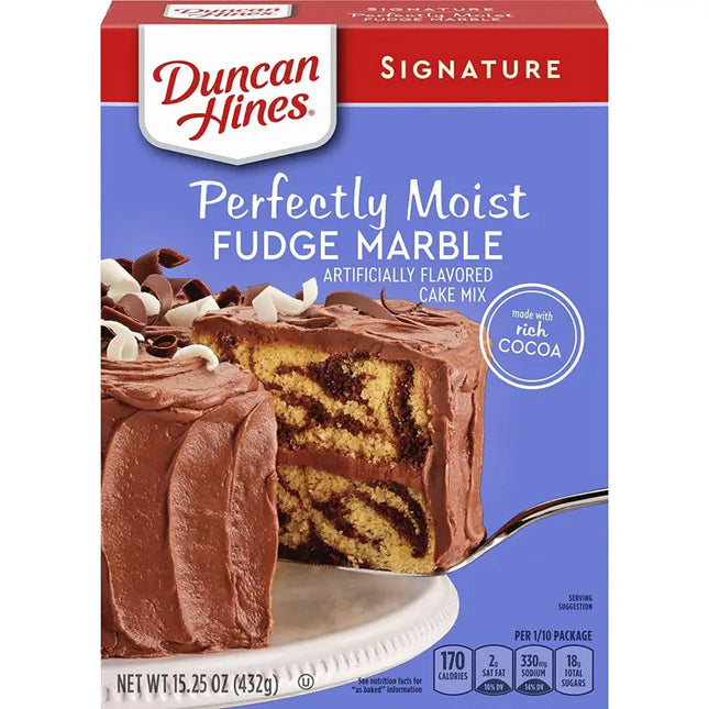 a close up of a box of duncan’s frosting with a cake in the background