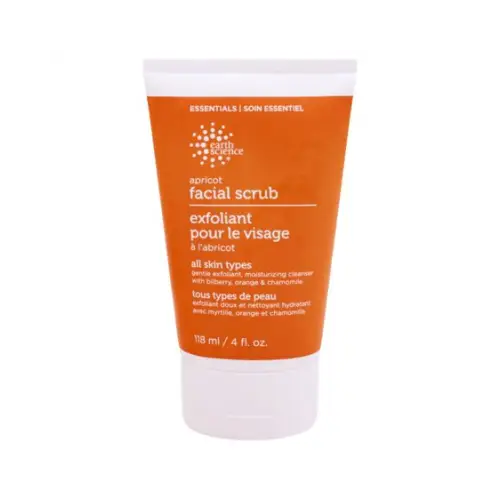 a tube of facial scrub with orange and white background