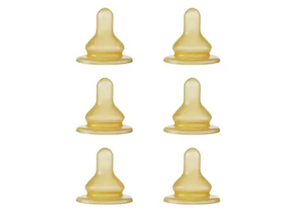 a set of six yellow plastic baby nipples