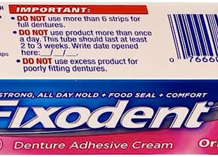 a close up of a box of fixdent cream on a white background