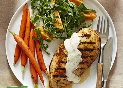 a plate with chicken, carrots and a salad