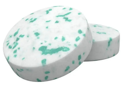 a white and green soap bar with a green spe on top