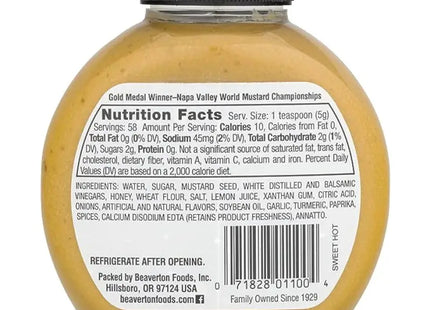 a close up of a bottle of mustard with a label on it