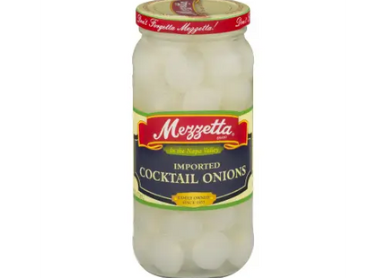 a close up of a jar of pickled cocktail onions