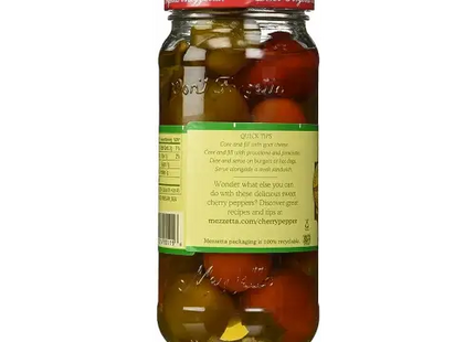 a close up of a jar of pickled tomatoes with a label