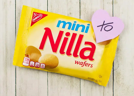 a yellow packet of nila with a pink heart on it