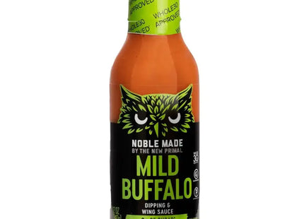 a close up of a bottle of hot sauce with a green label