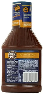 a close up of a bottle of bbq sauce on a white background