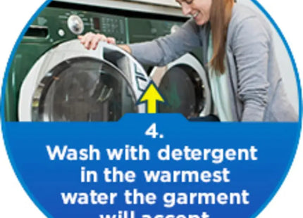 a woman is putting the washing machine in front of her