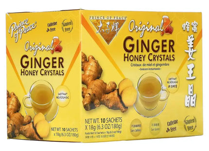two boxes of ginger honey crystals with a cup of tea
