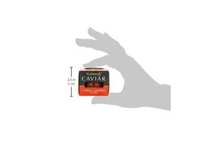 a hand holding a small container of cavar