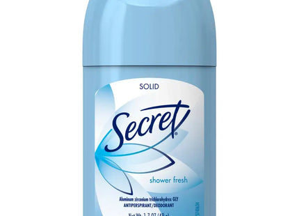 a close up of a blue bottle of deodorant on a white background