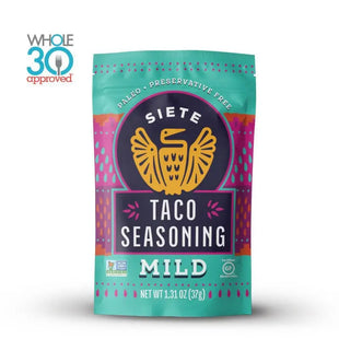 a bag of taco seasoning mild sits on a white surface