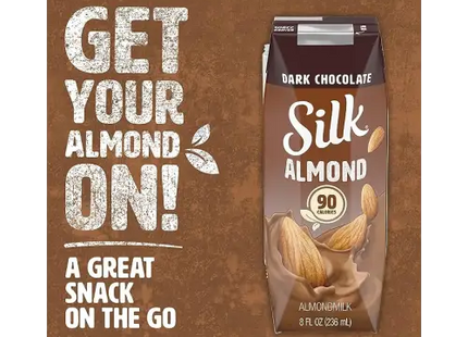 a close up of a carton of milk with almonds on it