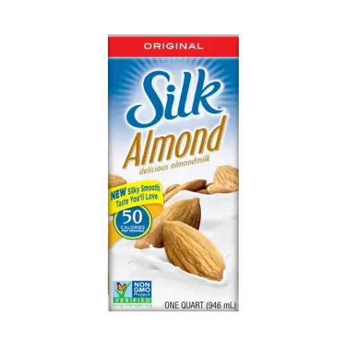 a close up of a carton of milk with almonds