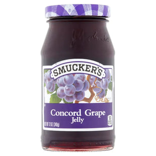 a close up of a jar of jam with blueberries on it