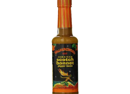 a bottle of hot sauce with a black background
