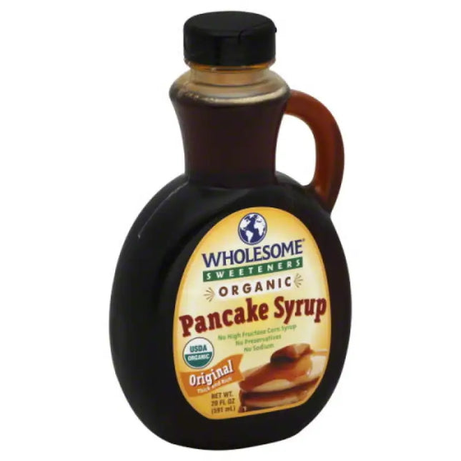 a close up of a bottle of syrup with a spoon